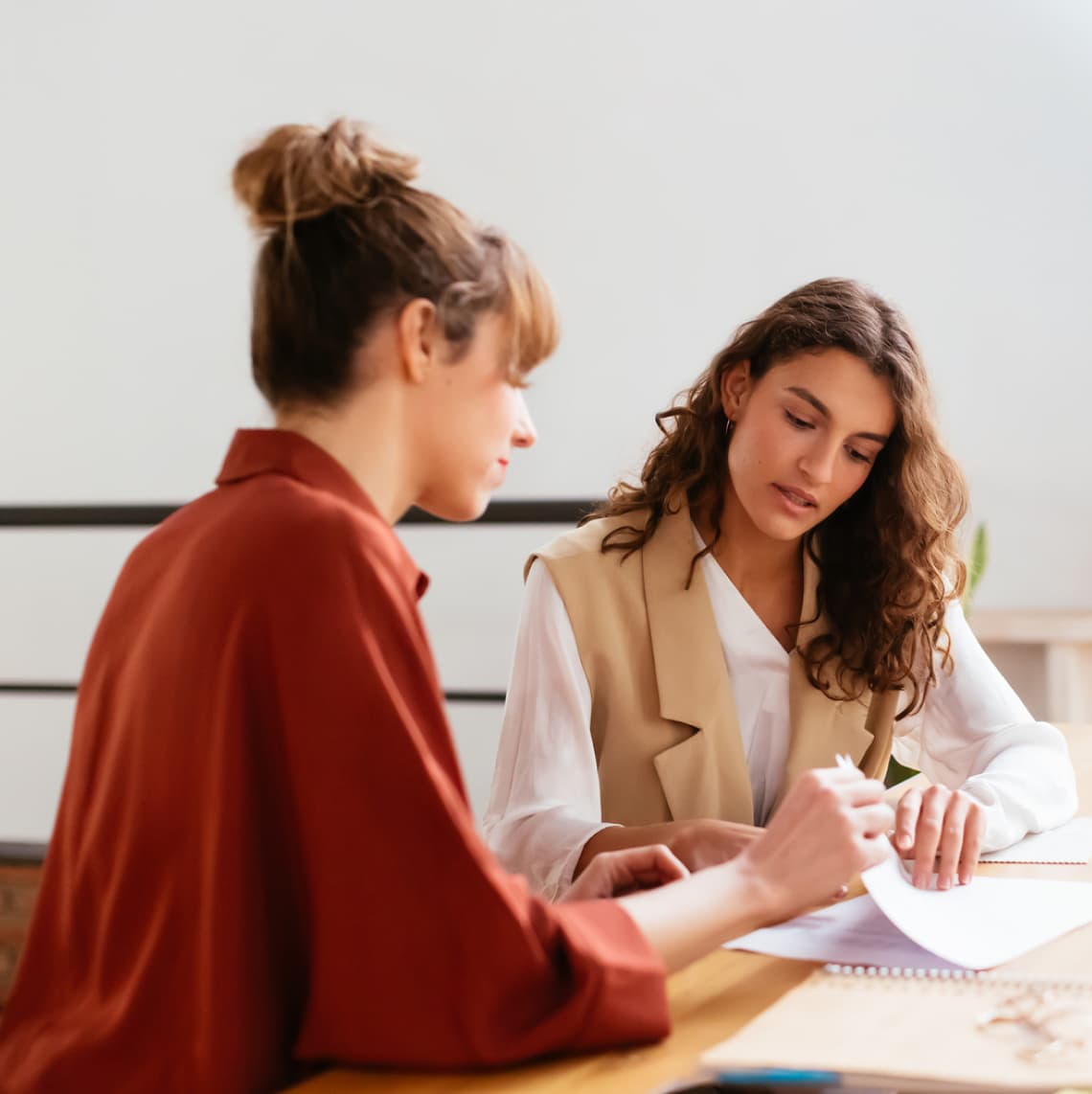 two females employees collaborating