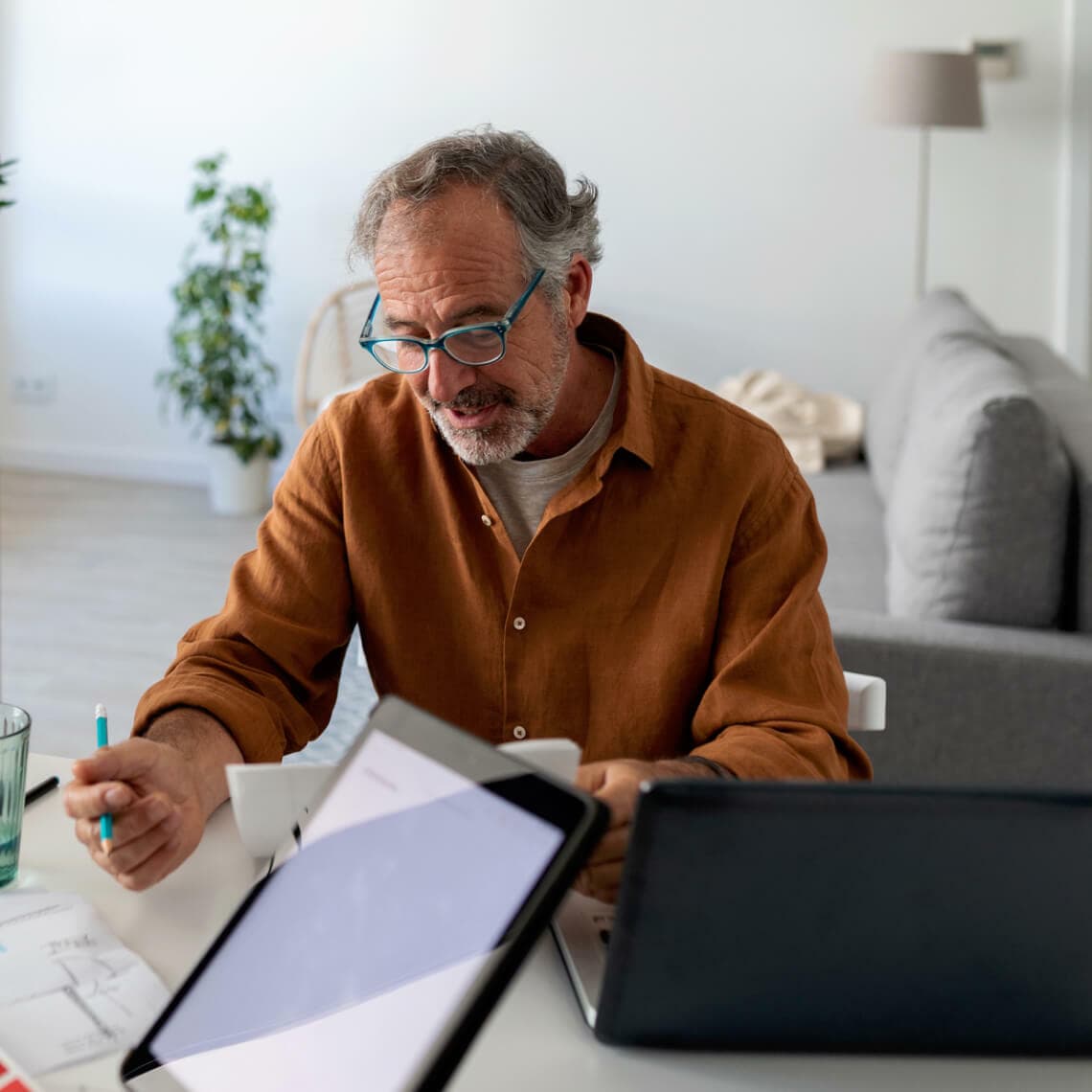 man with glasses working