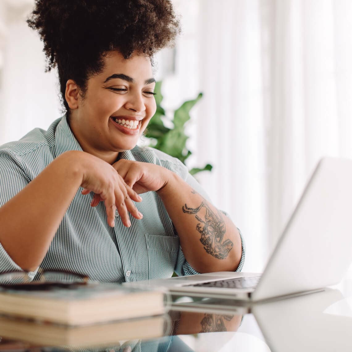 woman smiling working on computer