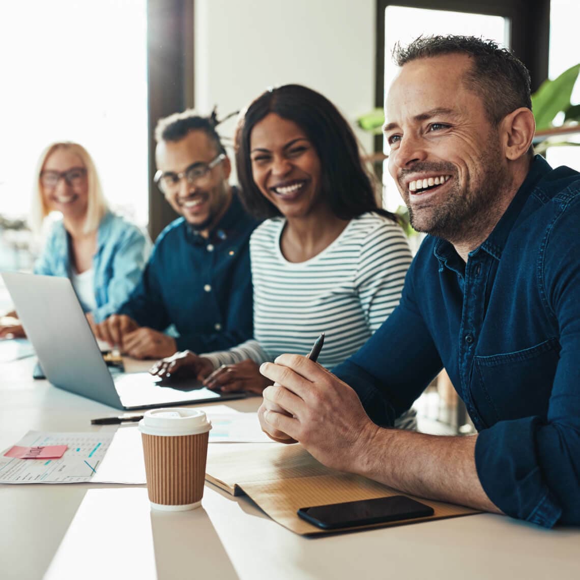 happy employees working together in office